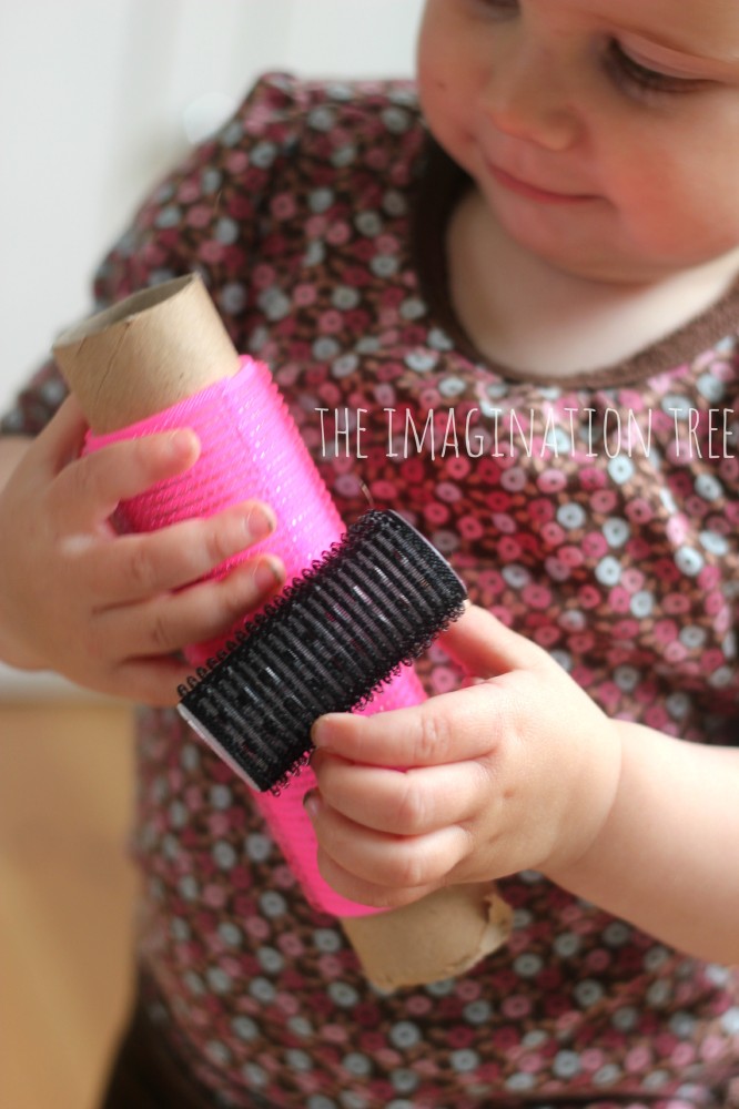 Baby-playing-with-hair-rollers-666x1000