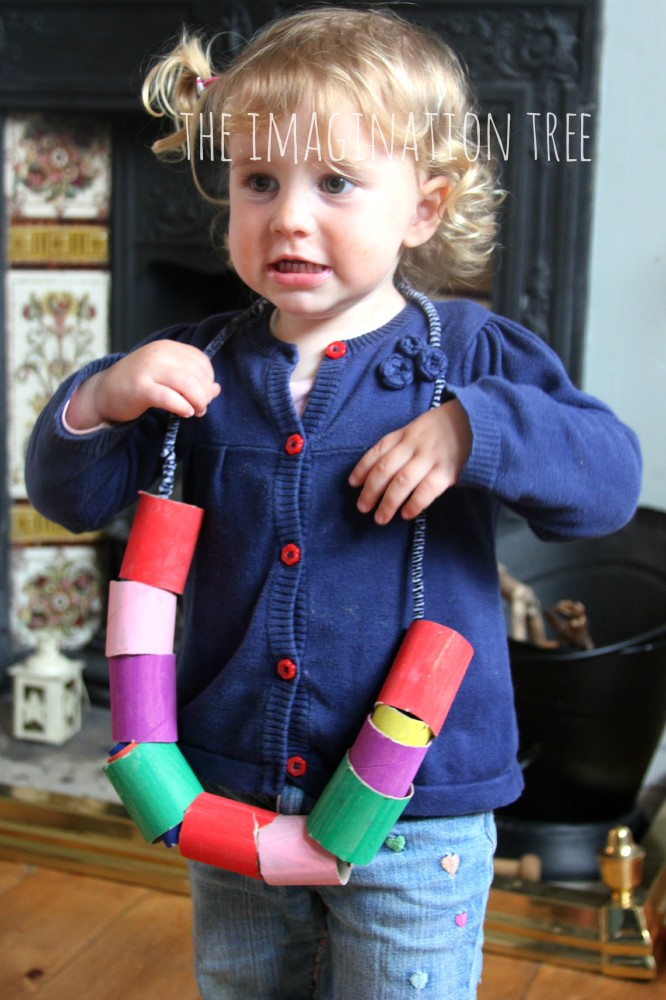 Toddler threading activity with cardboard tube beads