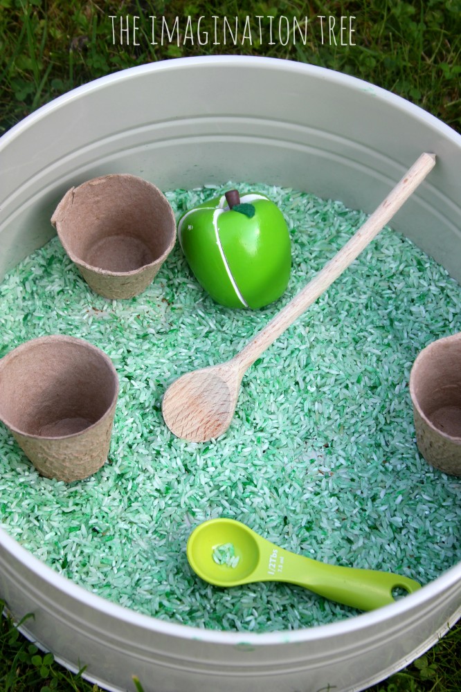 Apple cinnamon scented sensory rice tub for Autumn play
