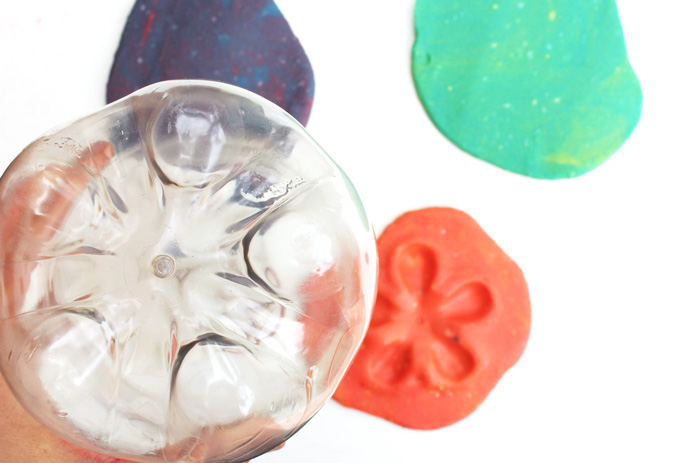 Here's a novel idea for play dough activities: use recycles as play dough toys. Recycled plastics have some amazing textures for kids to explore.
